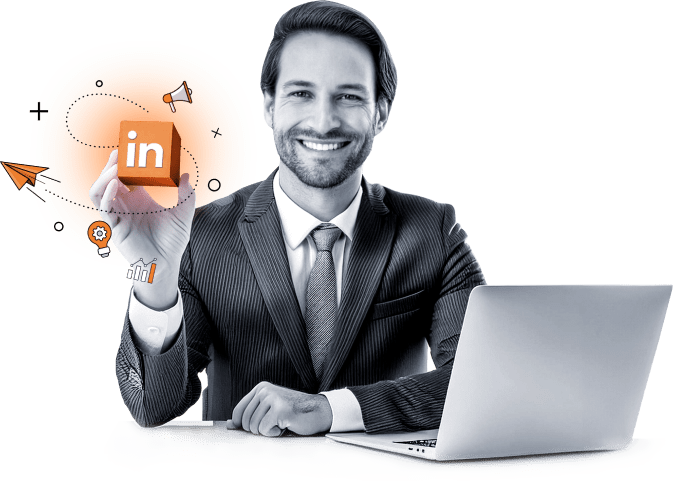 A smiling man in a suit sits at a desk with a laptop, holding an orange LinkedIn logo cube. Surrounding him are illustrated icons of a megaphone, lightbulb, graph, and paper plane, symbolizing networking and business growth.